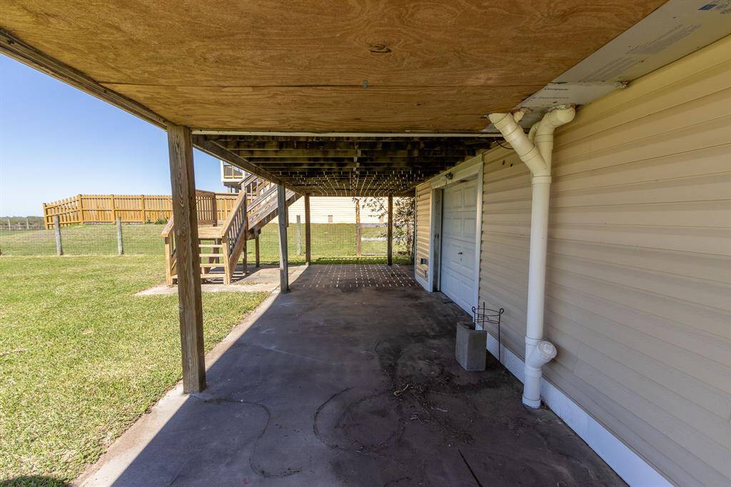 Paved, covered patio across the back of the home plus an additional garage door allows you to capture the cool breezes.