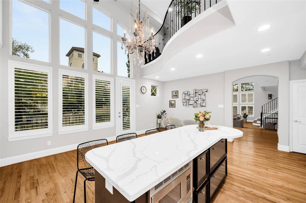 The large windows offer lots of natural light. This meticulously designed kitchen offers plenty of storage!