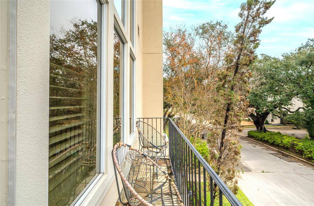 The balcony on the second story of the home, which opens from the kitchen, brings the outdoors inside! To your left is the famed Live Oak Park, perfect for picnics or recreation with kids and pets.