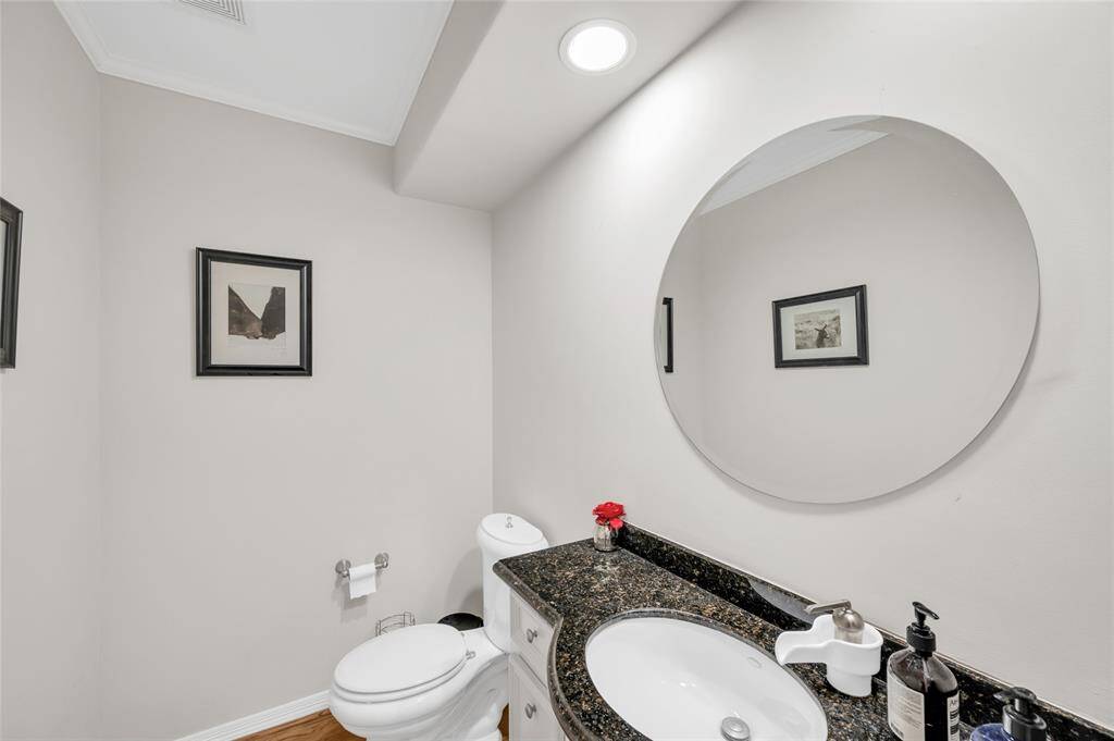 The second floor powder room is easily accessed by the living room, dining room, and kitchen.