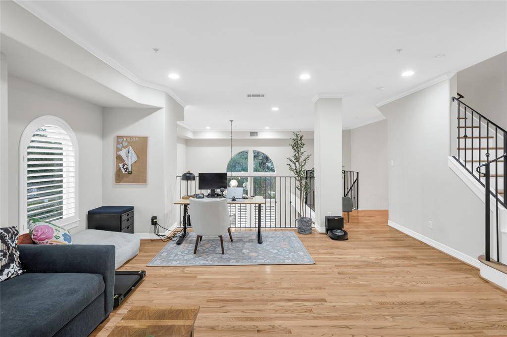 The third floor loft/bedroom functions well as a flex space. So many possibilities- a den, home office, or gym!