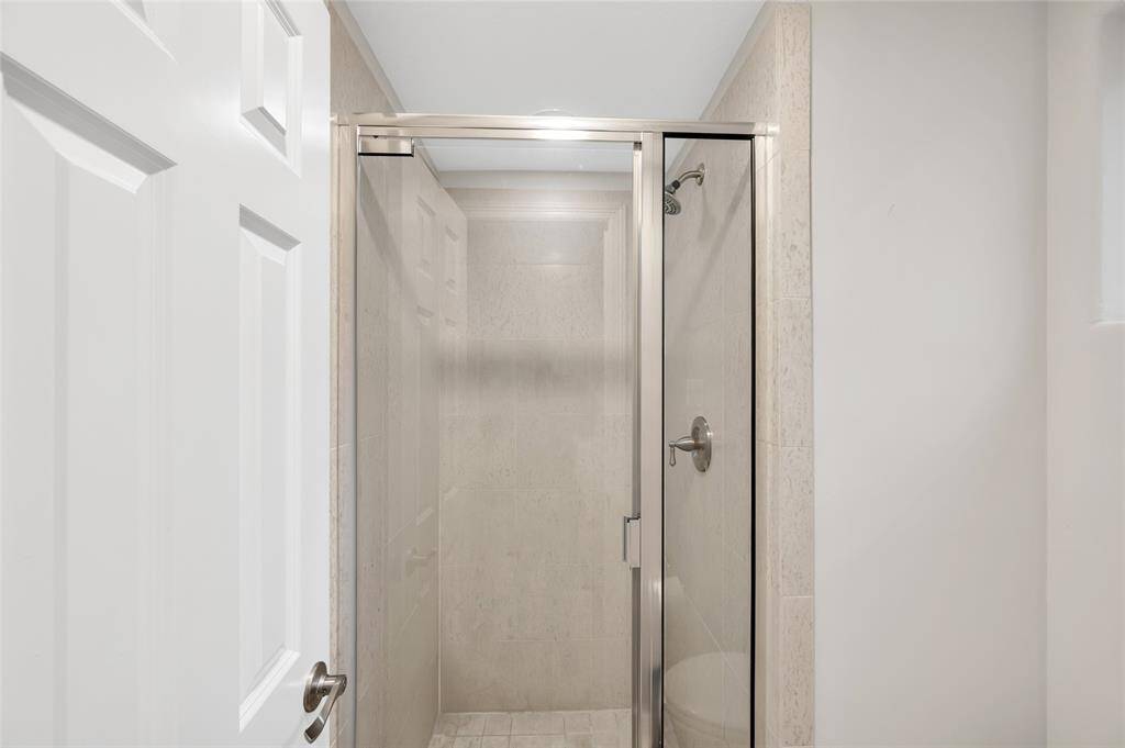 The large, walk-in shower adjacent to loft/bedroom.