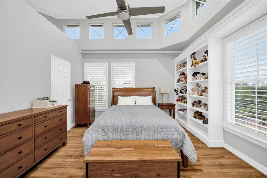 The secondary bedroom features a walk-in closet, lots of windows, and en-suite bathroom.