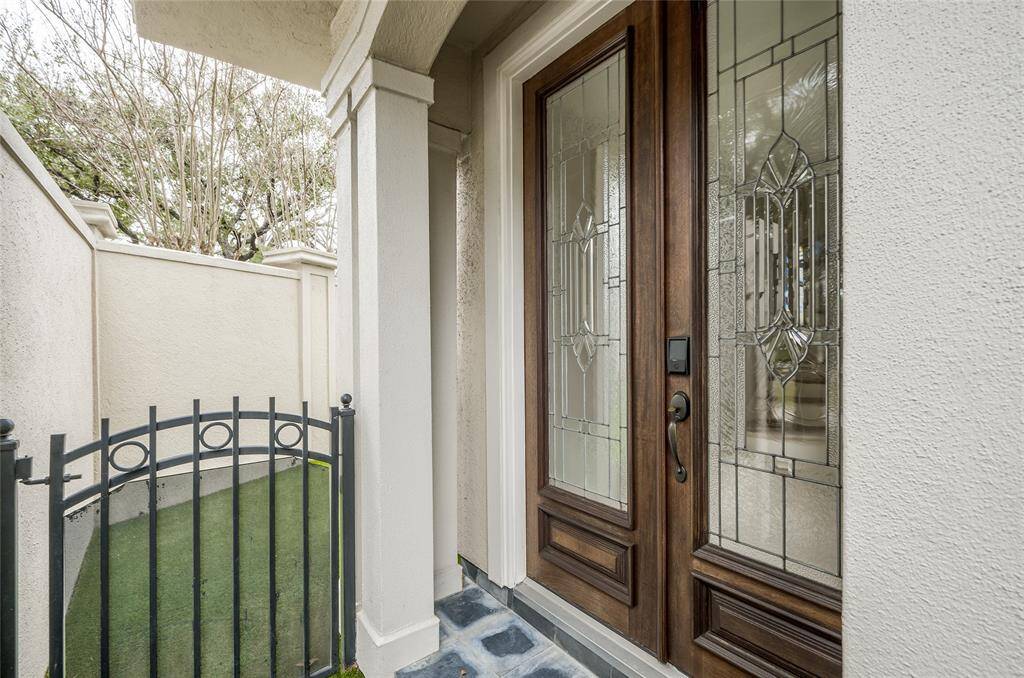 As you enter the front gate, the yard with greenspace, grill and fountain is to your left. A perfect space for recreation and outdoor entertaining!