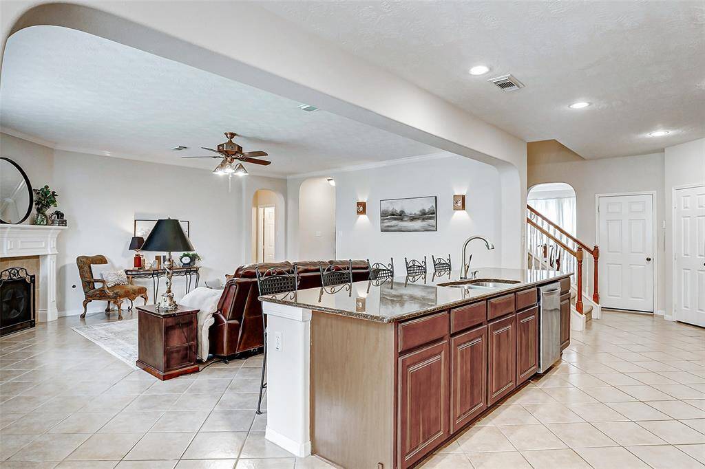Notice the second stairway access from the kitchen. The door on the left is to the garage and the door to the right is one of TWO walk-in pantries!