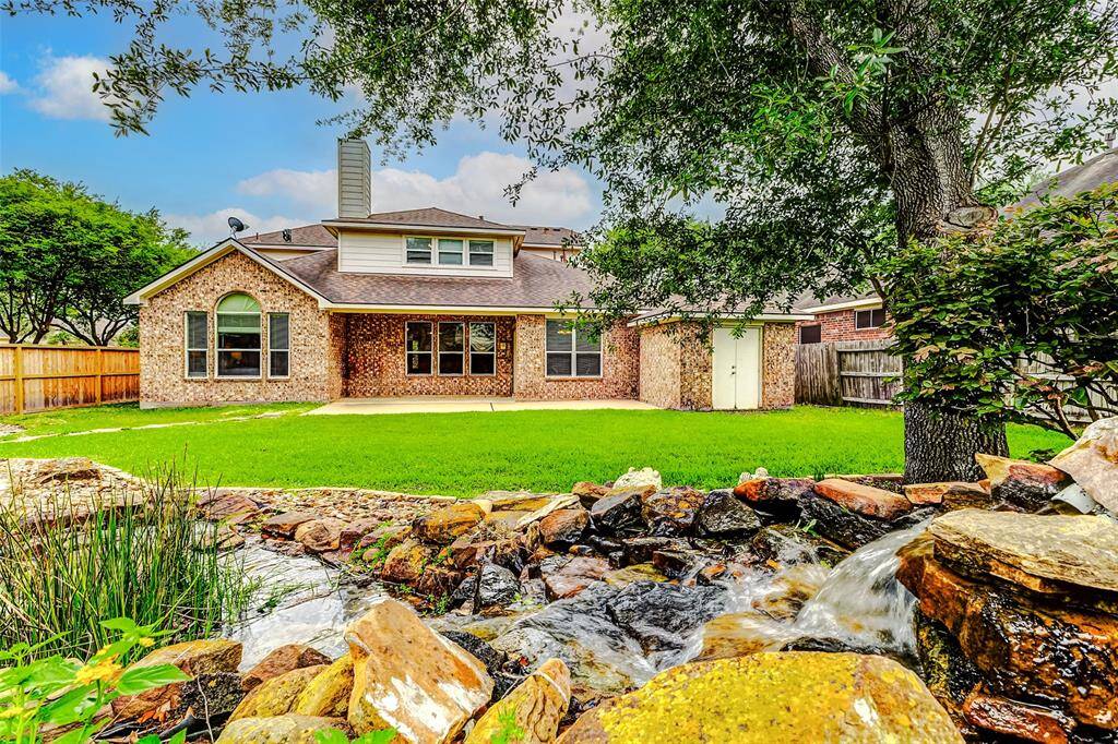 Relax in this treelined backyard paradise as you sit on the large covered back patio and listen to the waterfall into the custom Koi pond. With this 13,000 sq ft+ lot there is plenty of room for your dreams to become reality.