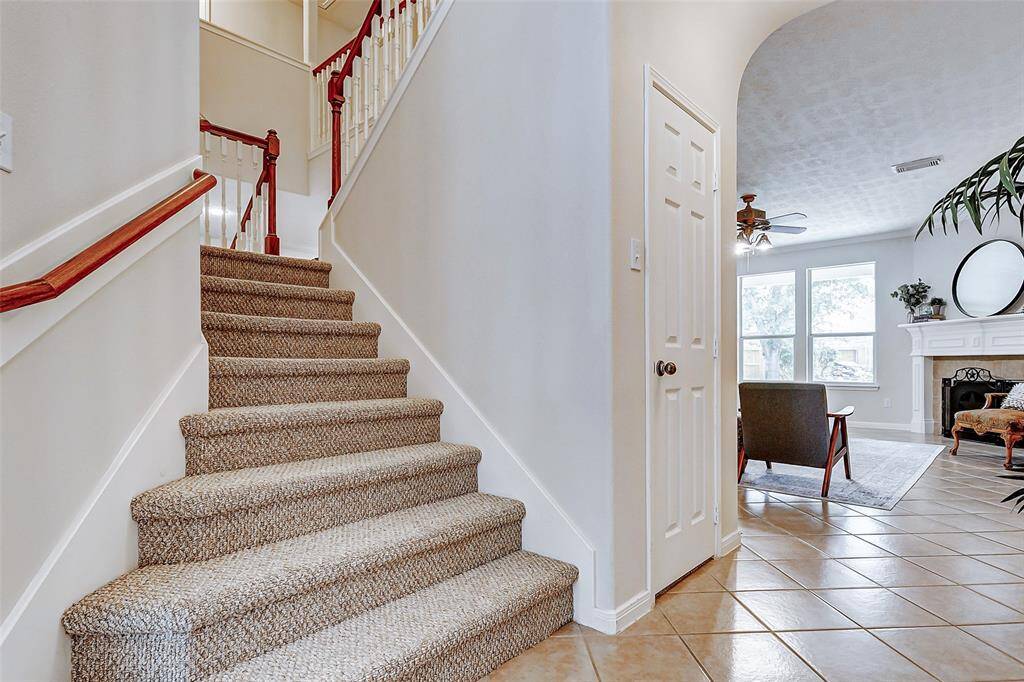 This door leads to a HUGE under the stairs wrap around closet.