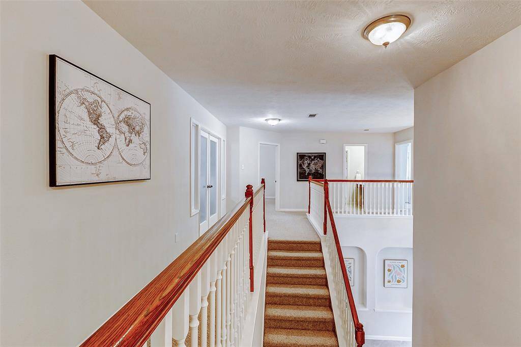 when you get to the top of the stairs there are two bedrooms and a bathroom in between. There is also a Game Room/Flex Room with double glass door entry.