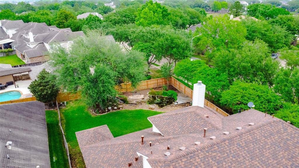 A birds eye view of the backyard. Roof was replaced in 2018. New Fence 2023.