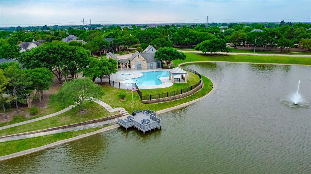 A view to the community pool area and one of the lovely lakes. Make your appointment today!
