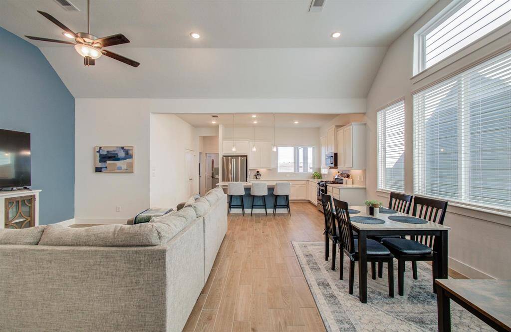 Open concept layout with the dining area just off the kitchen. Bonus seating at the kitchen island make this the perfect place to entertain.