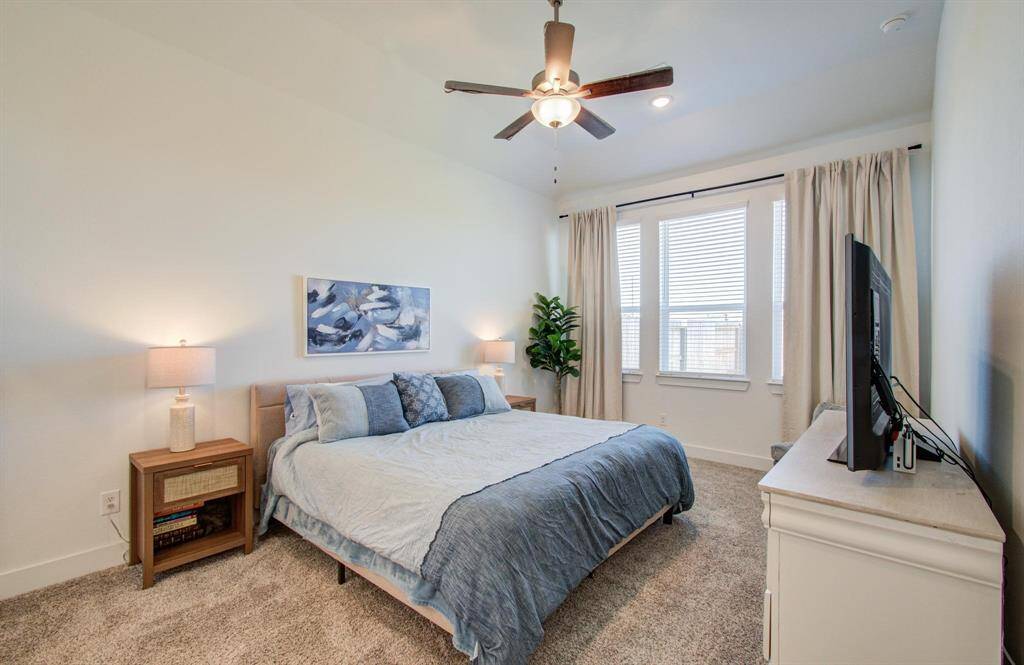 Primary bedroom is a great size - plenty of room for king sized furniture. Windows provide great light and no back neighbors provide extra privacy. Neutral colors, ceiling fan, plush carpeting - you can move right in!