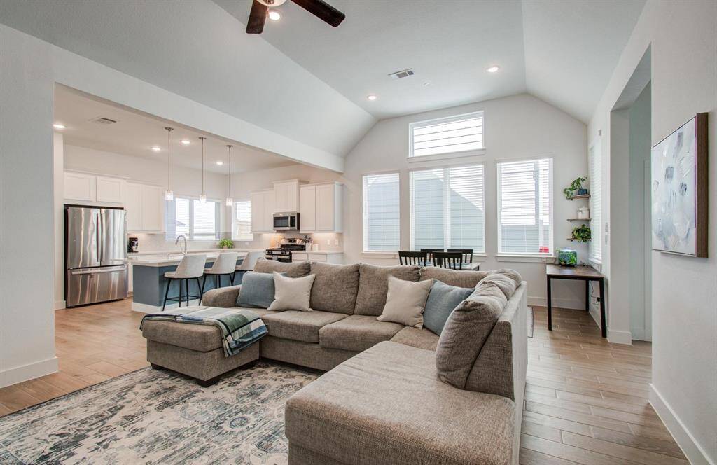 Walking in feels like your own oasis with the vaulted ceiling, gorgeous light LVP flooring and open concept layout.