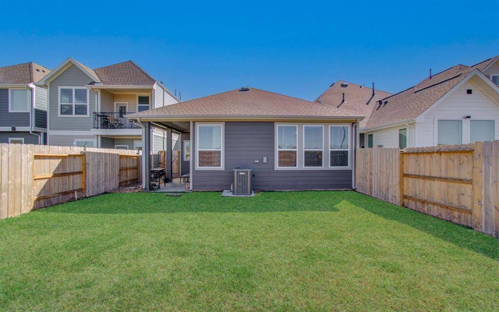 To the backyard! You will love the covered patio (great for grilling and enjoying the spring weather).