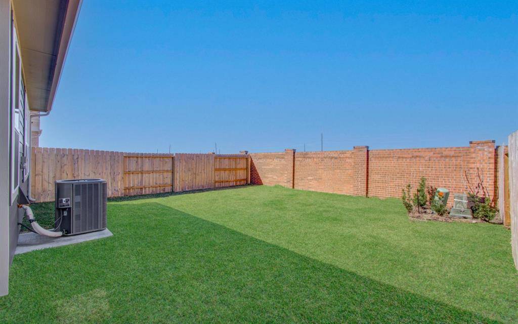 Spacious backyard is unique because there are NO back neighbors! You will love the tranquility and privacy of that.