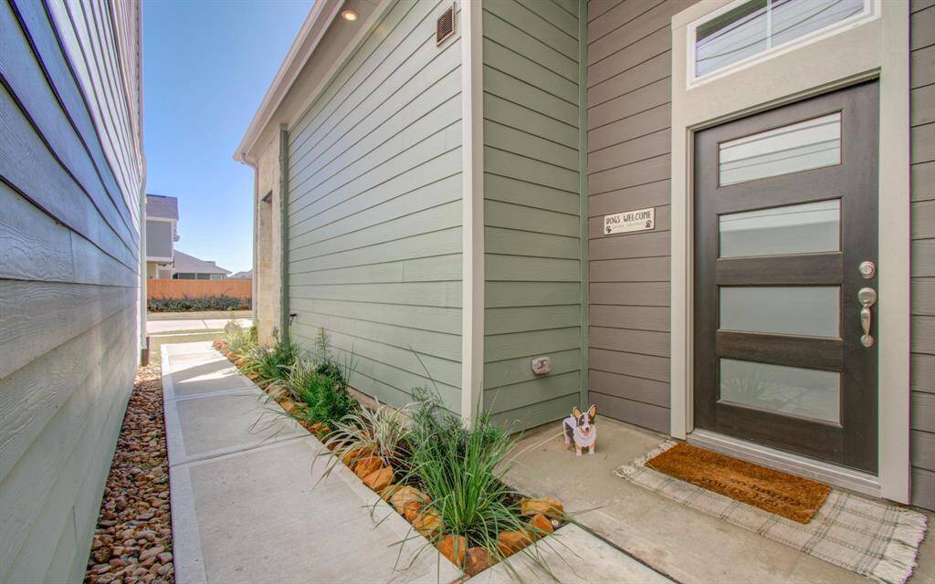 Now, let's start back at the beginning - upgraded front door and landscaping greets you.