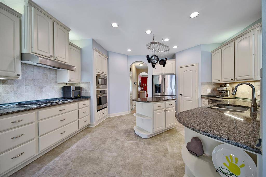 Plenty of counter and cabinet space including shelving that's perfect for storing cookbooks.