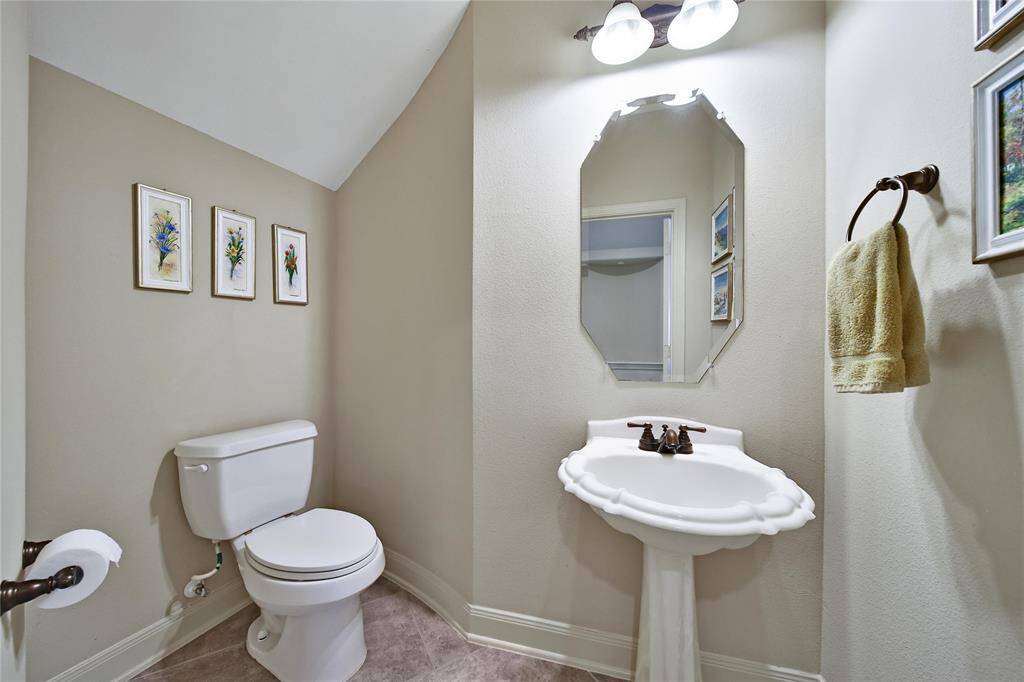 Convenient half bath for guests.