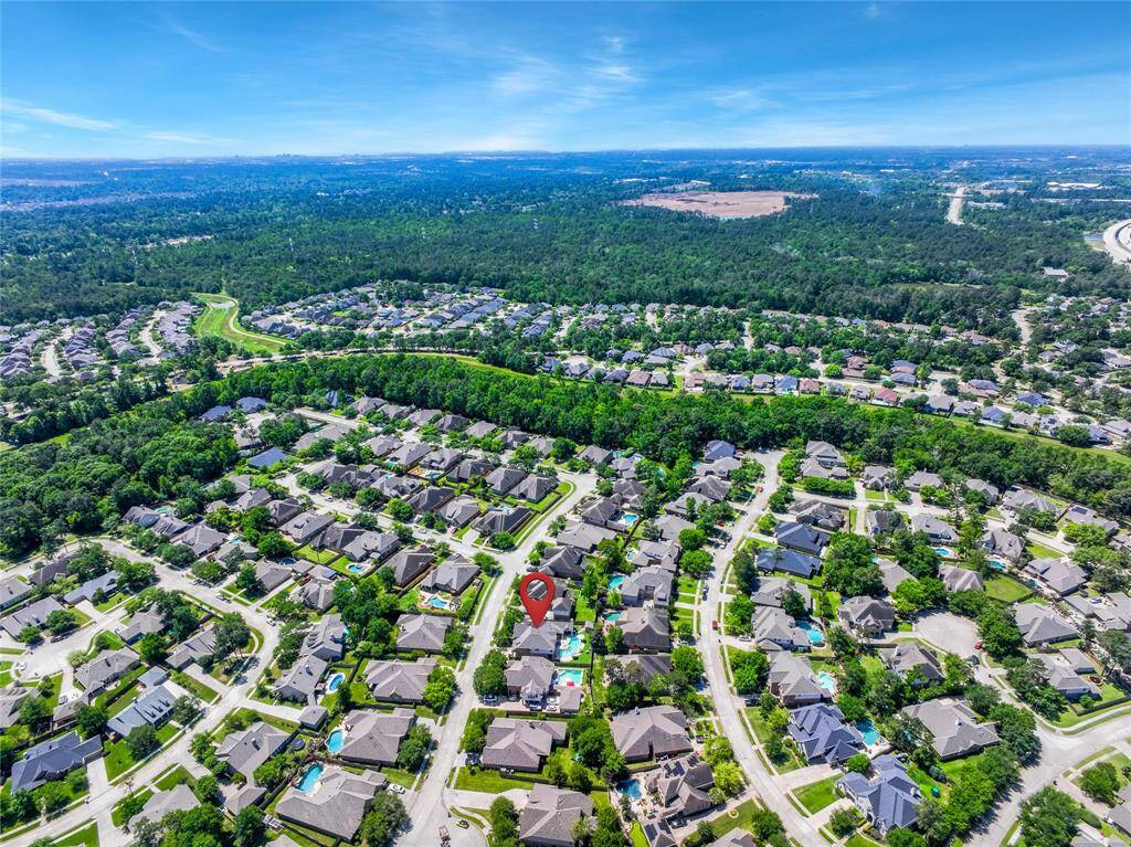 A visual representation of the connected Spring Creek Greenway abutting the community with natural trails for hiking or biking and an educational nature center.