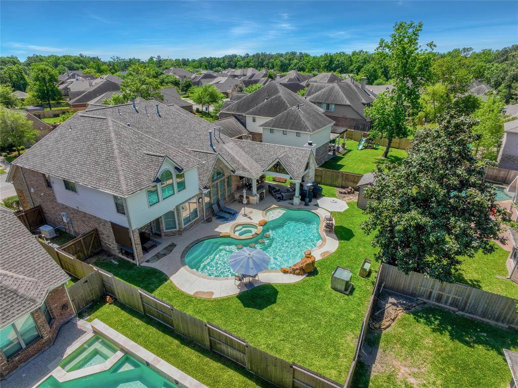 Located in the gated enclave of Sweet Bay Crossing in Spring Trails - most of the homesites are 80ft lots offering extra space between neighbors.