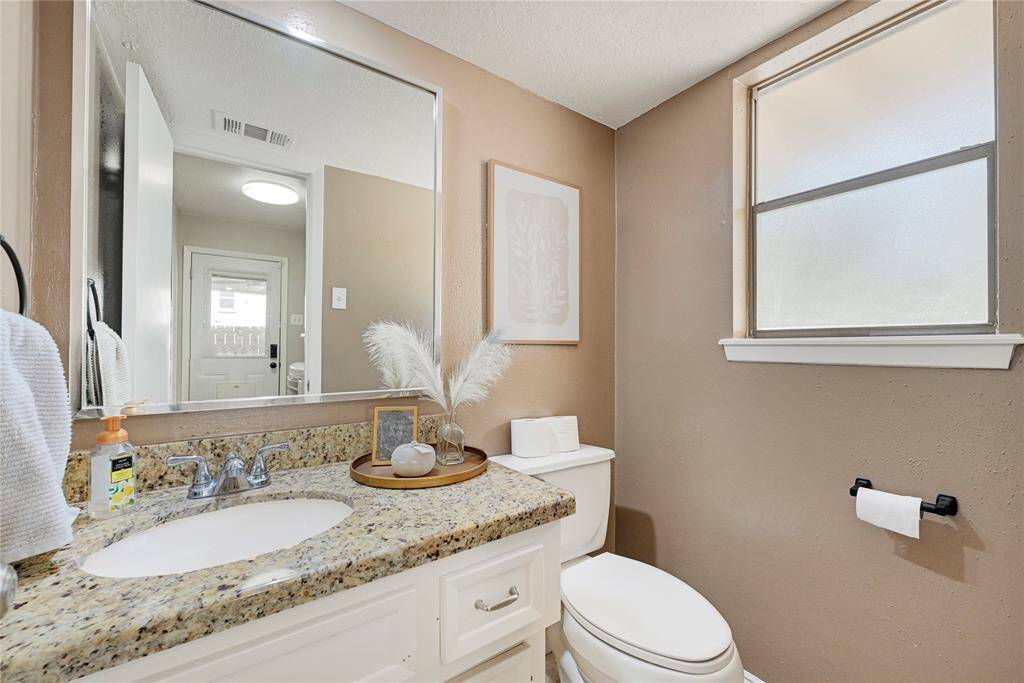 Half bath adjacent to Utility room