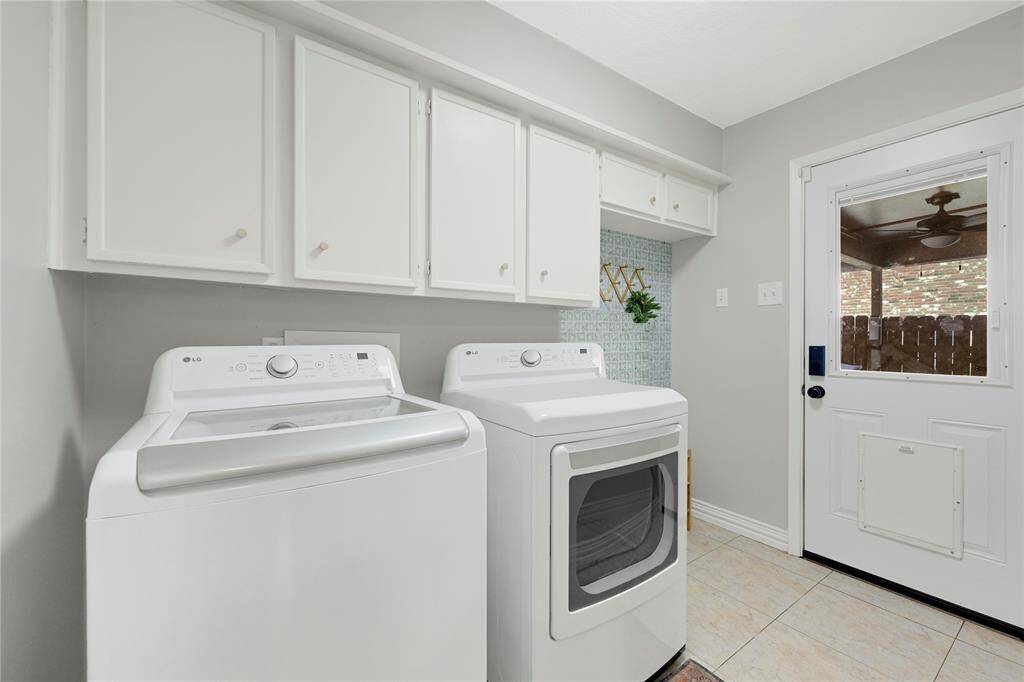 utility room with access to backyard patio.