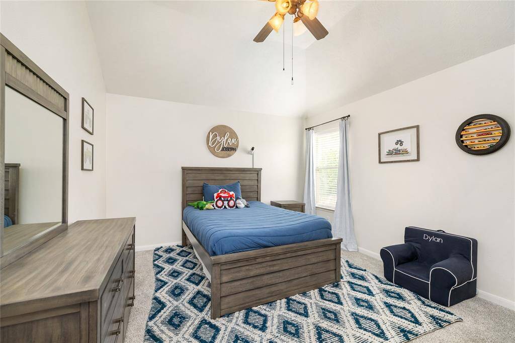 Each of the secondary bedrooms offers a bright and welcoming atmosphere, thanks to large windows that fill the rooms with an abundance of natural light. With ceiling fans for added comfort and spacious closets for all your storage needs, these rooms provide a perfect blend of style and practicality. Ample space ensures everyone enjoys their own comfortable retreat.
