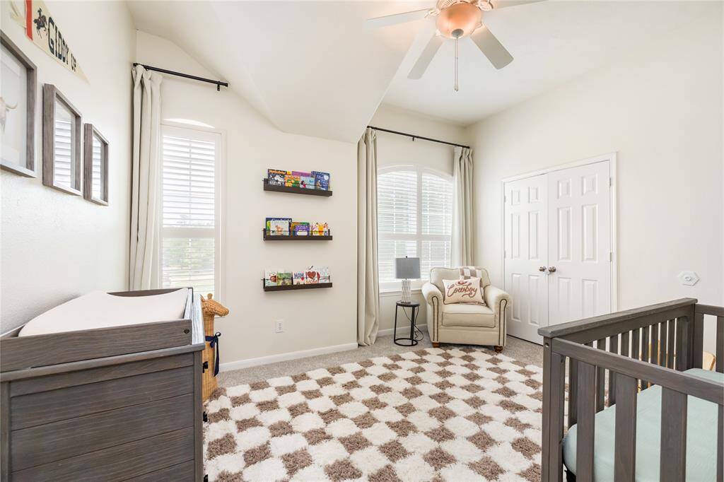Each of the secondary bedrooms offers a bright and welcoming atmosphere, thanks to large windows that fill the rooms with an abundance of natural light. With ceiling fans for added comfort and spacious closets for all your storage needs, these rooms provide a perfect blend of style and practicality. Ample space ensures everyone enjoys their own comfortable retreat.