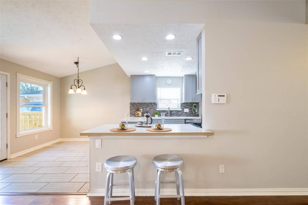 Open kitchen creates a welcoming, airy space perfect for entertaining.