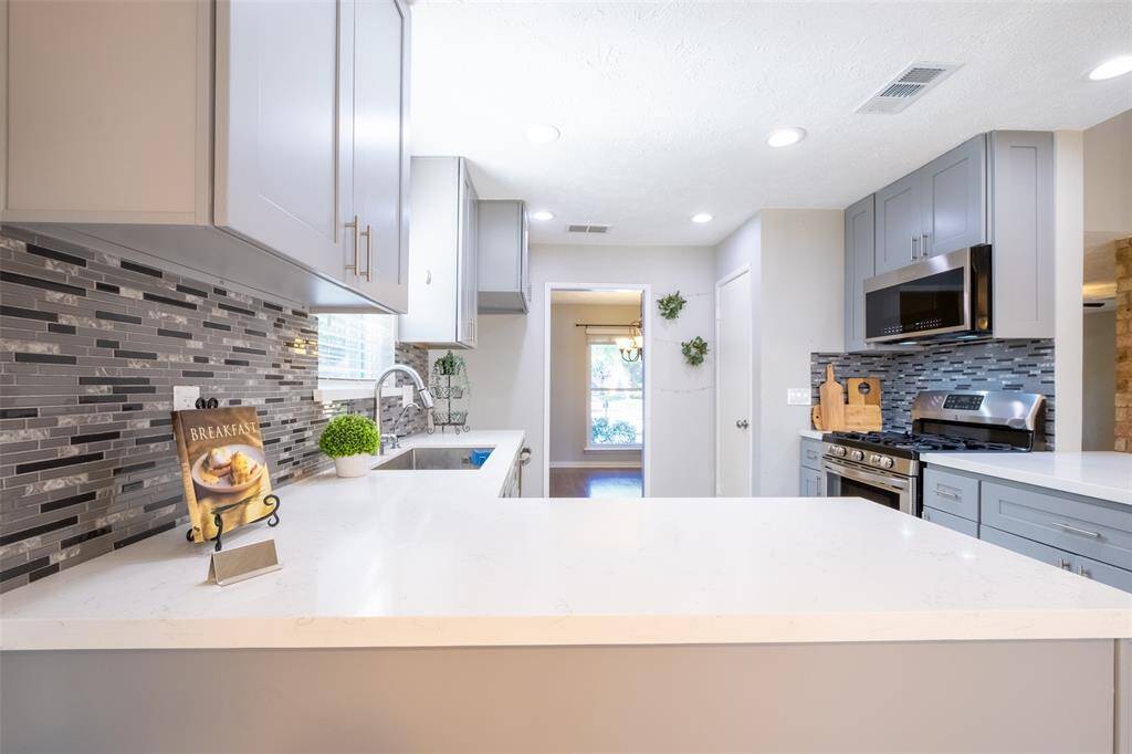 Bright and open layout with ample counter space, perfect for cooking and entertaining.