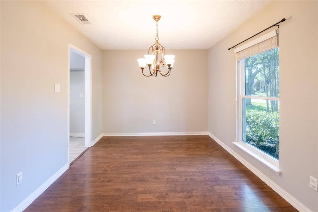 Formal Dinning offering plenty of natural light and a view of the greenery outside