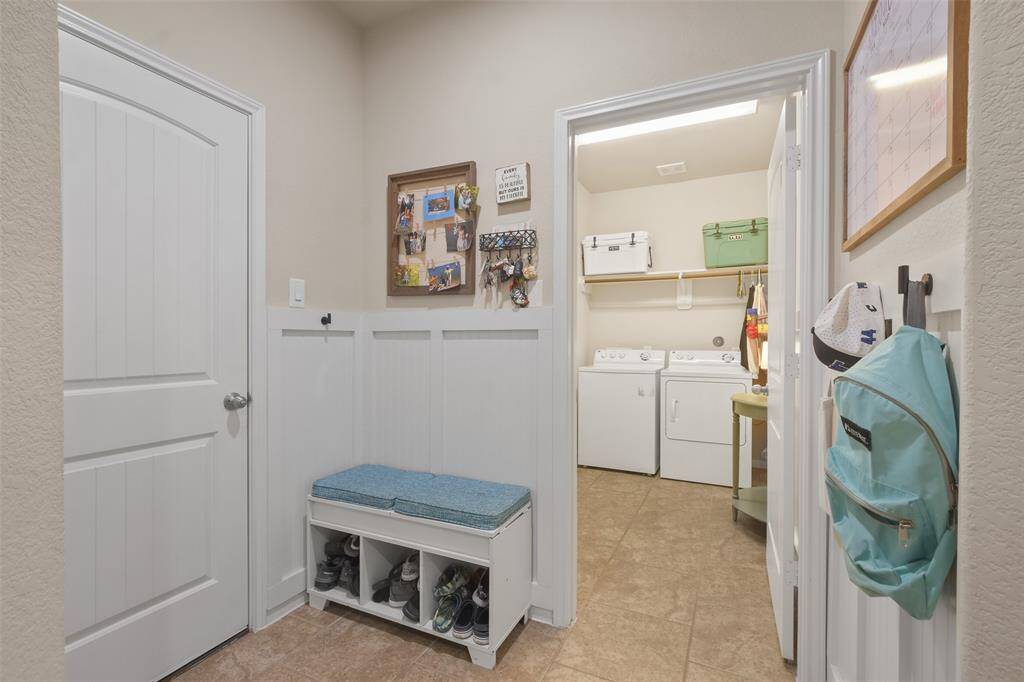 Custom mudroom space leads into GIANT utility room. Door to left is garage entry