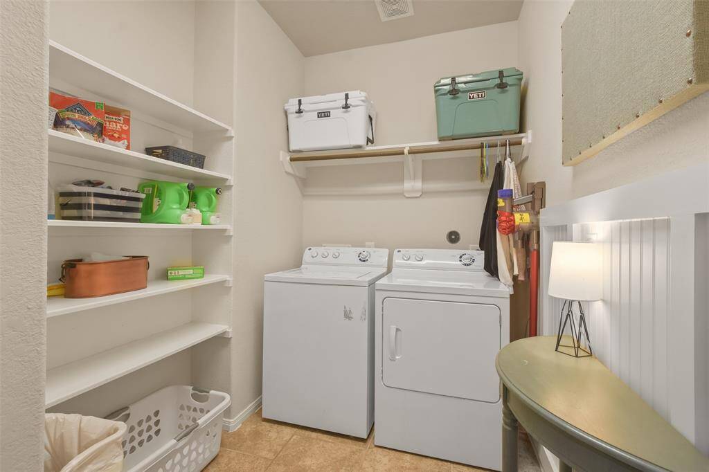 WOW! Huge laundry room with shelves AND a closet