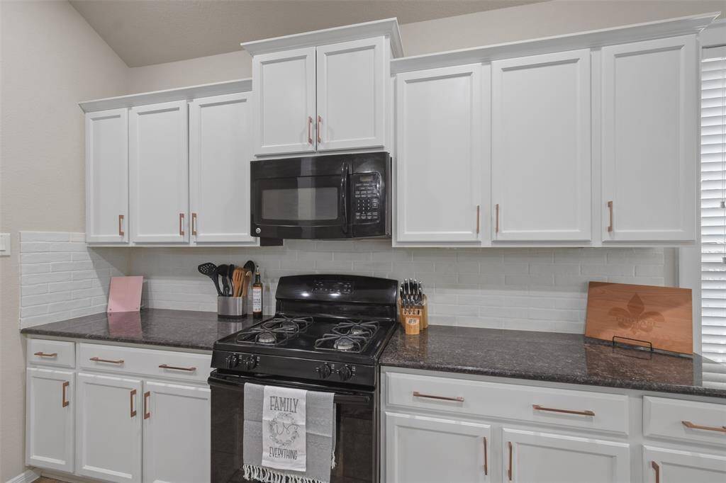 Cultured subway tile backsplash was added by homeowner