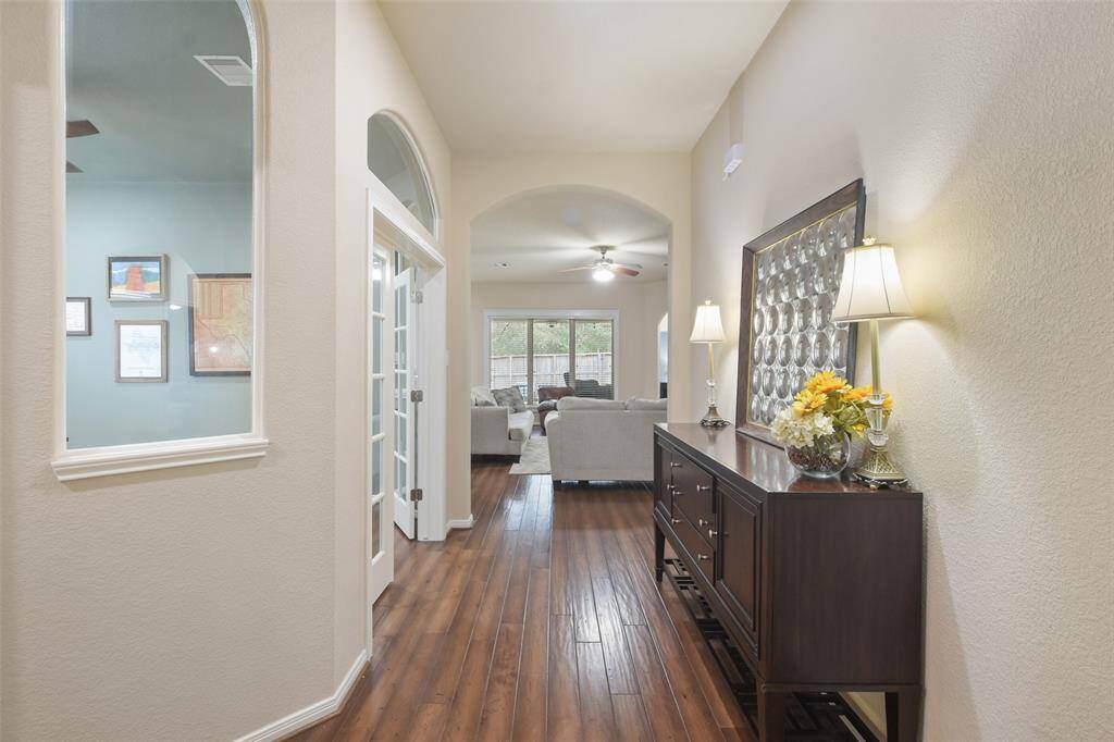 Handsome wood flooring welcomes you in