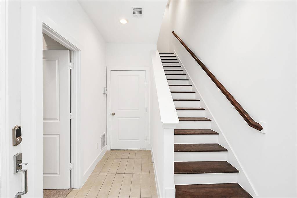 As you enter the home, 1st secondary to the left with full bathroom. Door with access to the garage