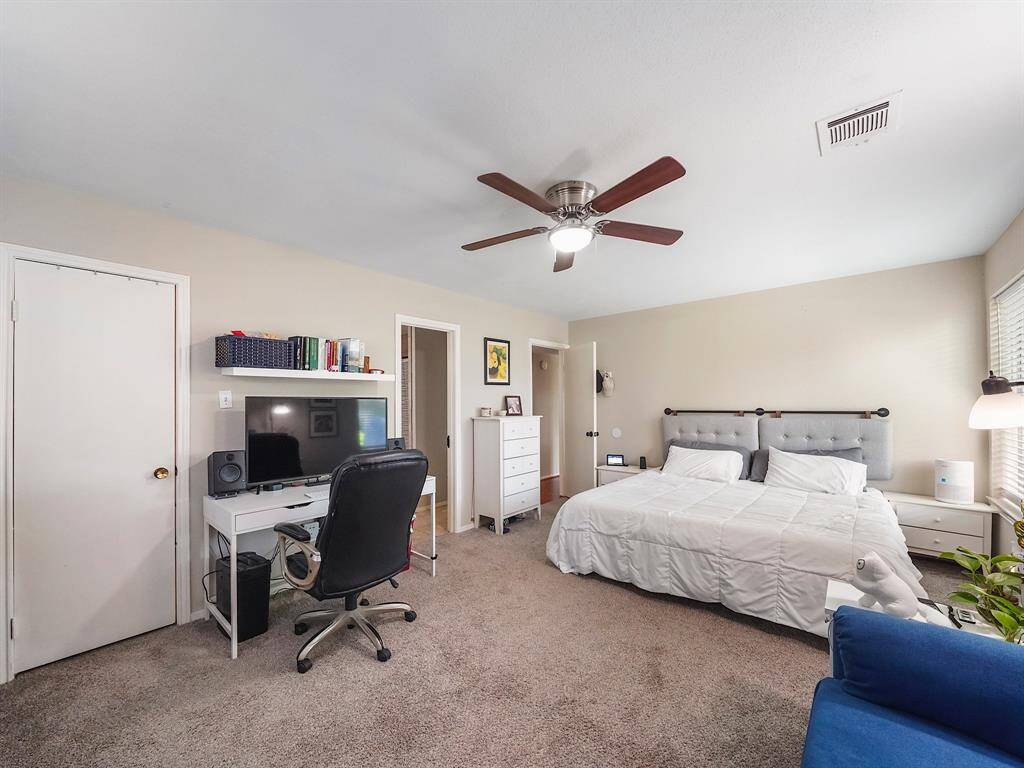 The generously sized primary retreat offers plenty of room for a king-size bed and all your favorite furniture, creating a comfortable and functional space.