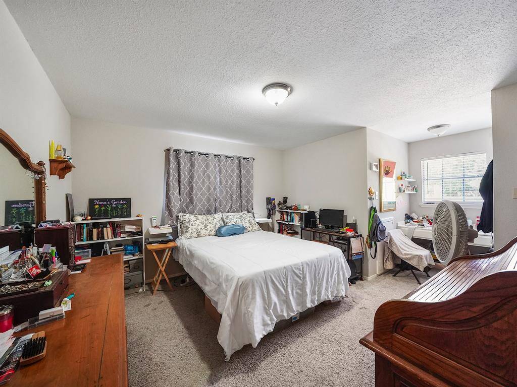 Bedroom #3 provides a comfortable and practical space, featuring a convenient built-in desk perfect for work or study, along with a generously sized closet to keep things organized.