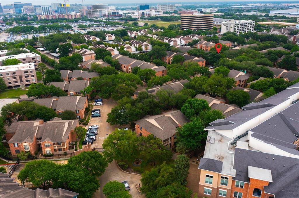 Braeswood Park is a gated community tucked away in the trees in the heart of the Texas Medical Center. At the bottom of this photo you can see the gated entry to the community. The red mark denotes unit 196, which is in the middle of the community for privacy.