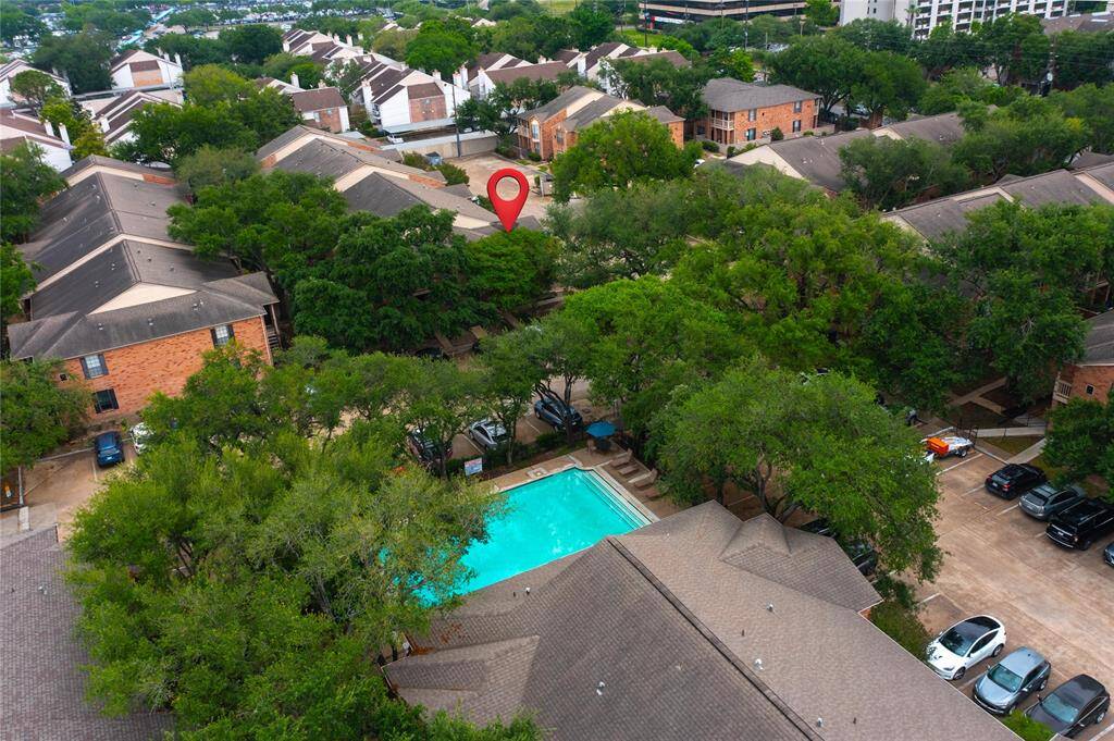 The corner location of Unit 196 allows for ample parking, great natural light & easy access to the pool which is located across the drive from the unit.