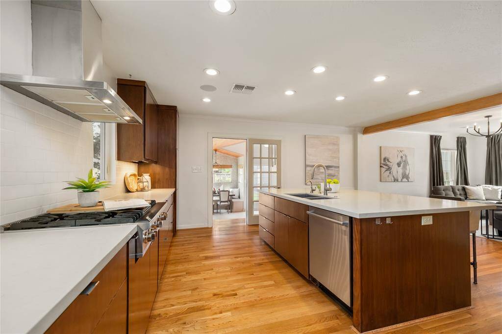 Enjoy seamless flow from the modern kitchen to the inviting den, perfect for entertaining and relaxation.