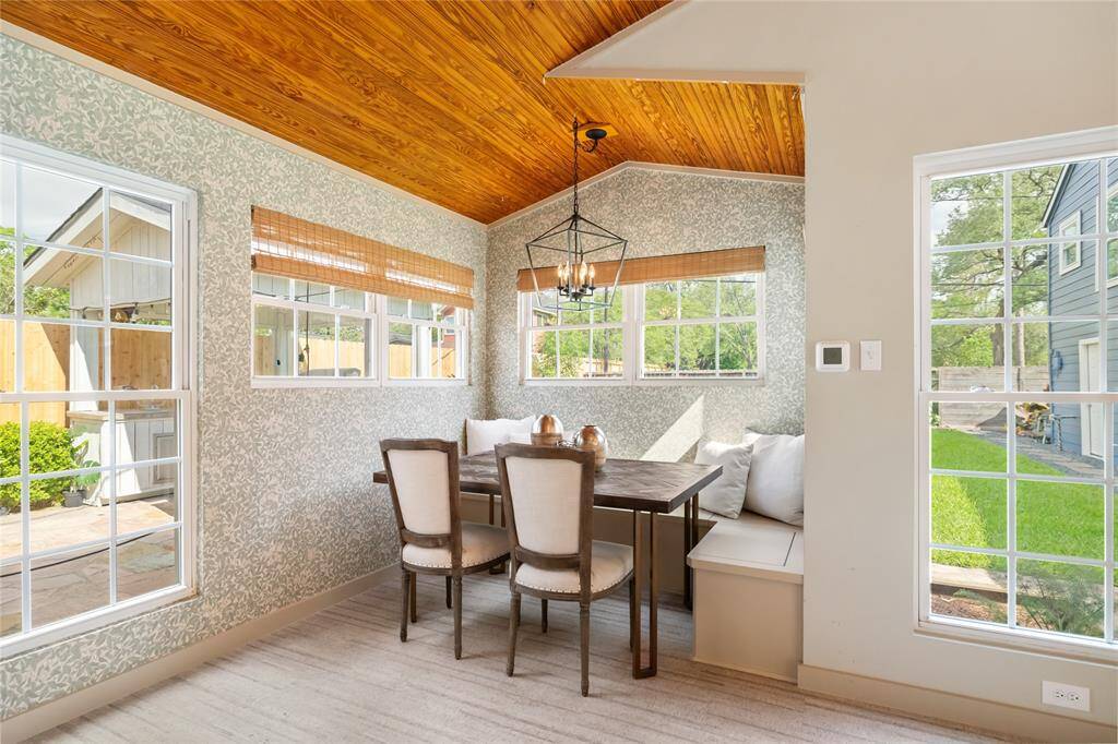 Breakfast area has builtin bench seating with storage