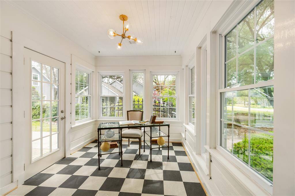 Amazing sunroom is a perfect home office or playroom