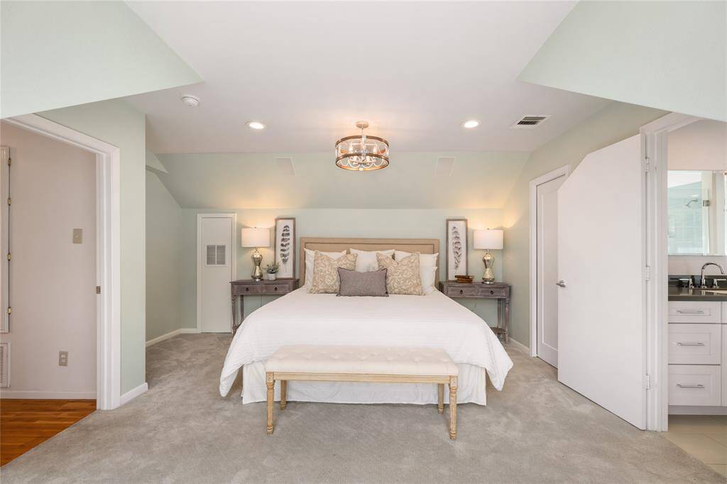 Cozy primary suite with bench window seating, huge walk-in closet, and en-suite bathroom