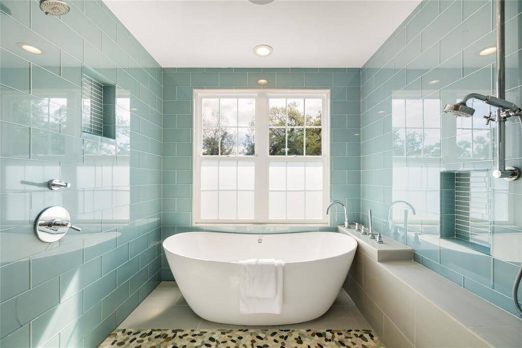 Relax in the enclosed shower with soaking tub