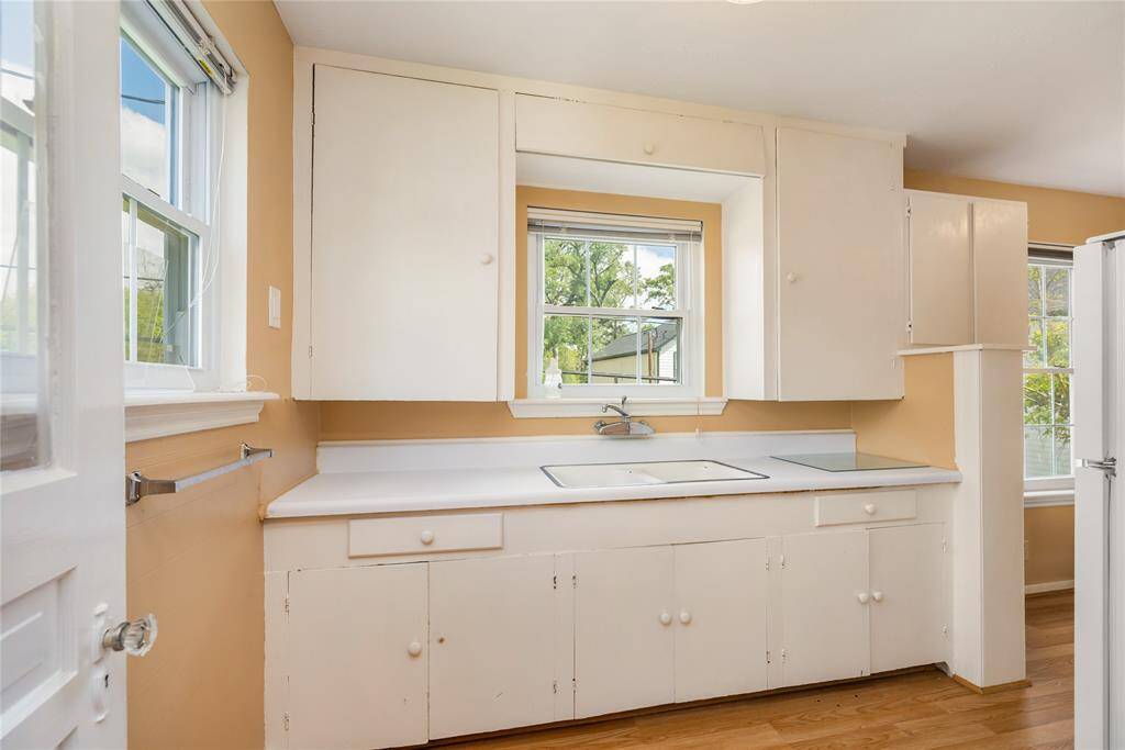 The apartment kitchen is separated from the living