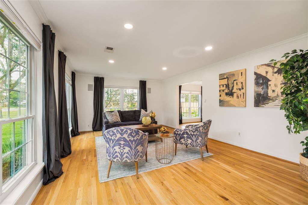 Bright and inviting front living room with abundant natural light.