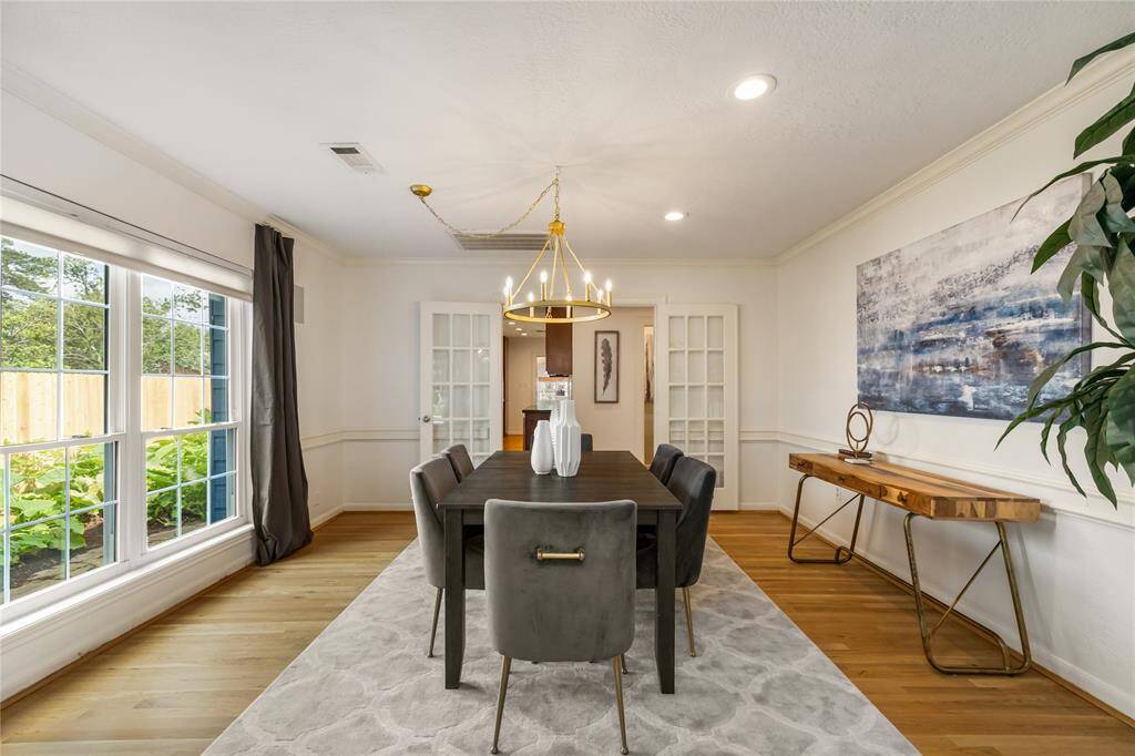 Bright dining room seamlessly connects the living area and kitchen.