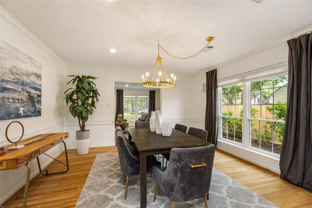 Bright dining area seamlessly flows into an inviting living room, perfect for entertaining.