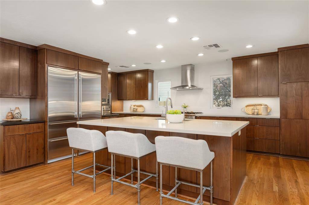 This island kitchen features premium appliances and ample storage.